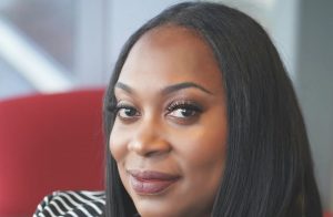 Marquetta Atkins is pictured, sitting in a red chair.