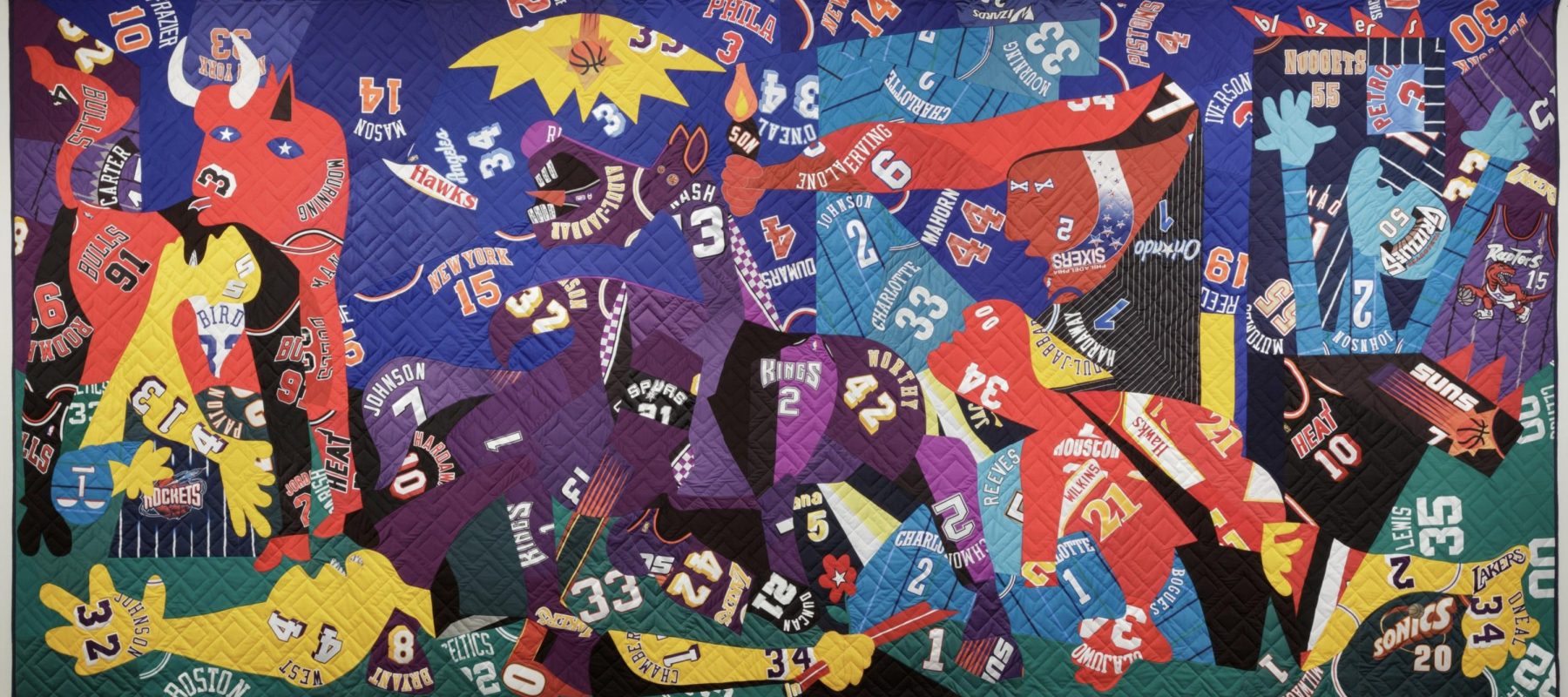 Many sports jerseys are sewn together into a quilt that is a version of Pablo Picasso's painting, Guernica.