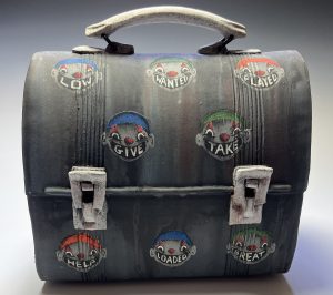 A lunchbox made of fired stoneware.