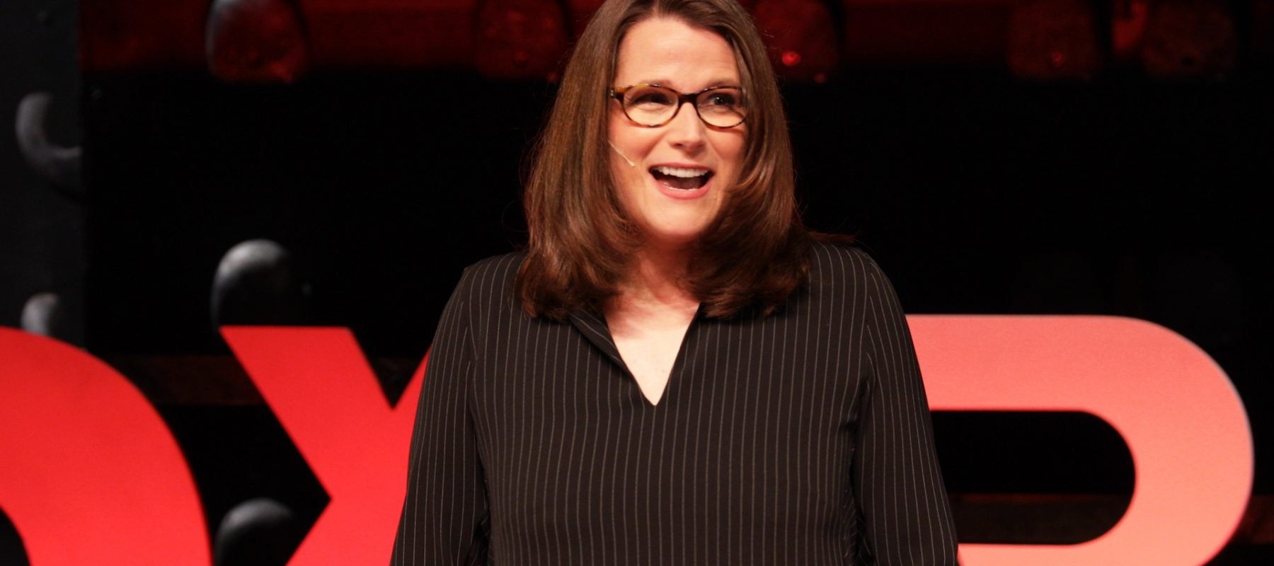 A woman is giving a speech.