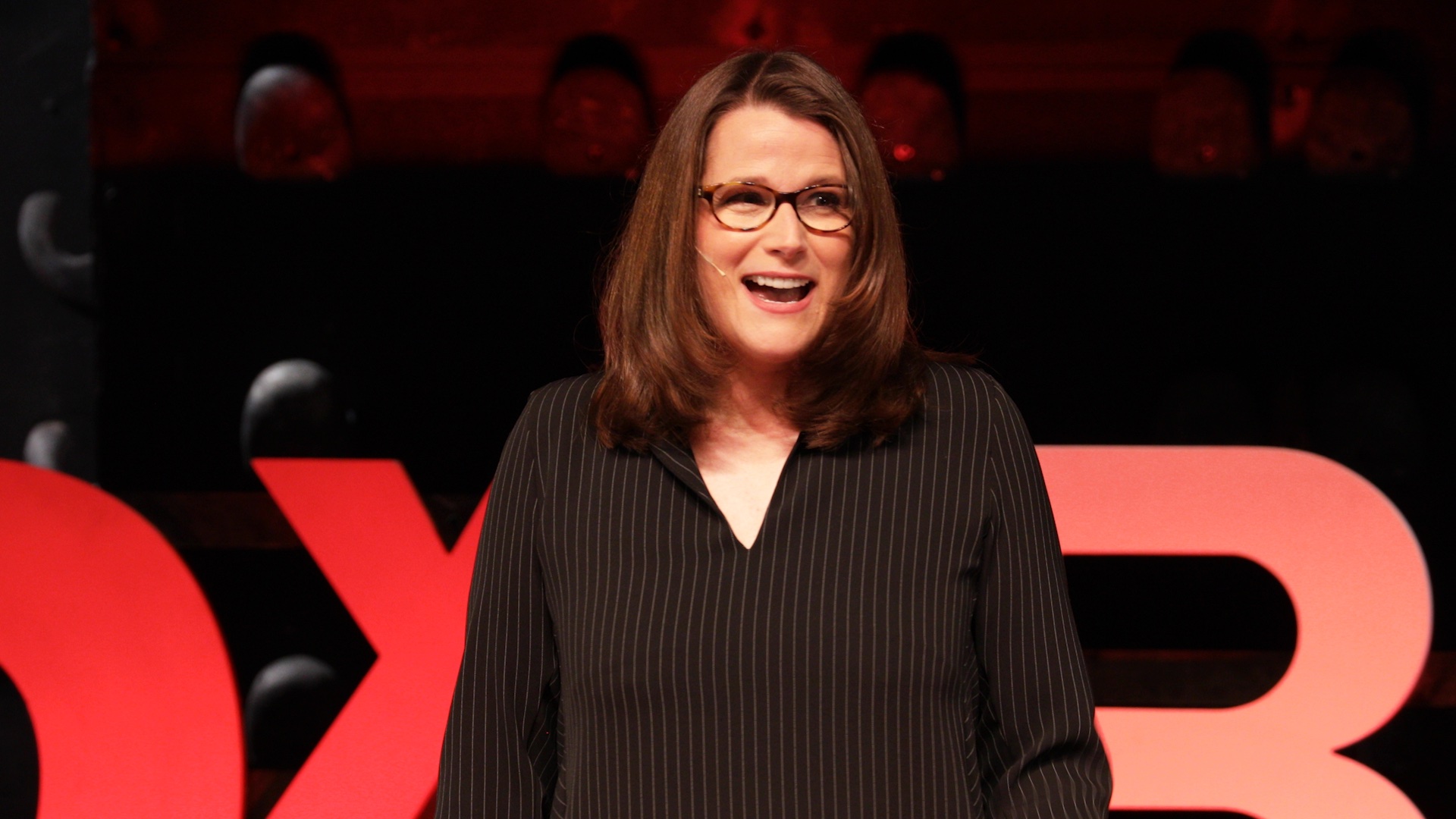 A woman is giving a speech.