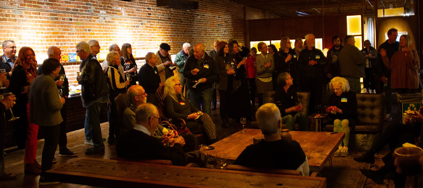 A group of people listen to an artists talk