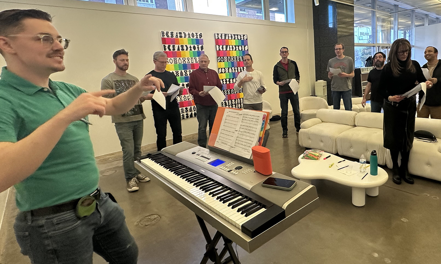 A group of adults sing together.