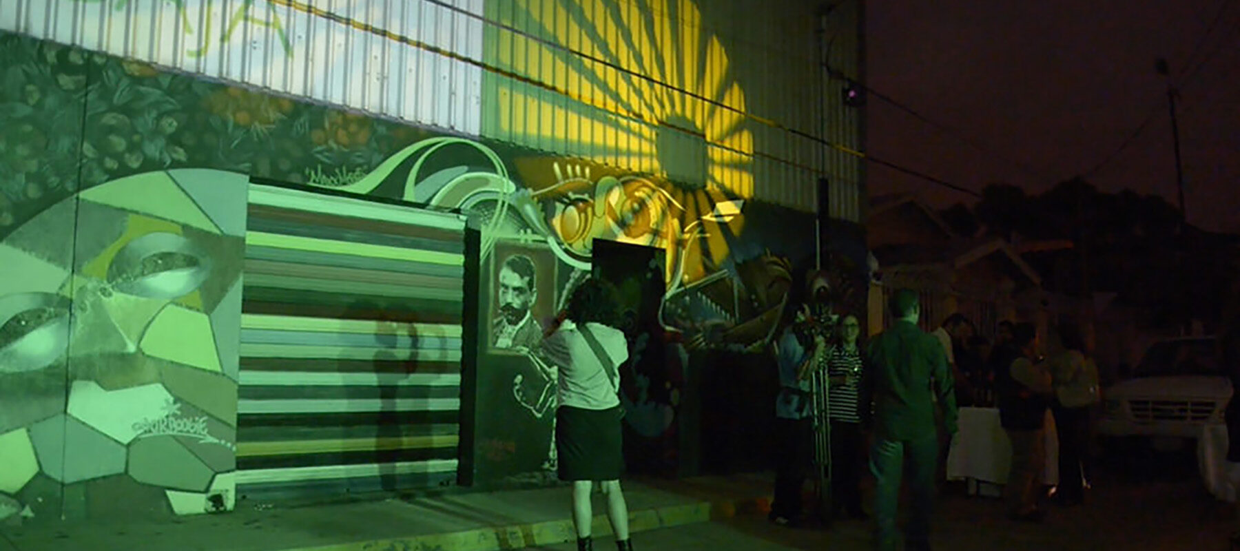 Visitors observe an art installation.