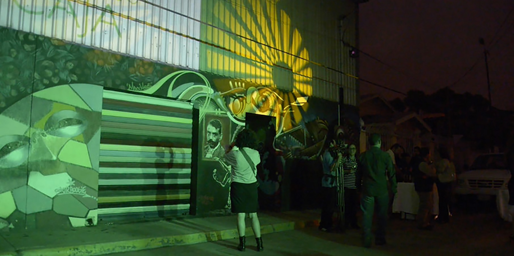 Visitors observe an art installation.