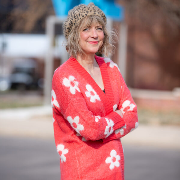 Smiling blond woman in a leopard beret