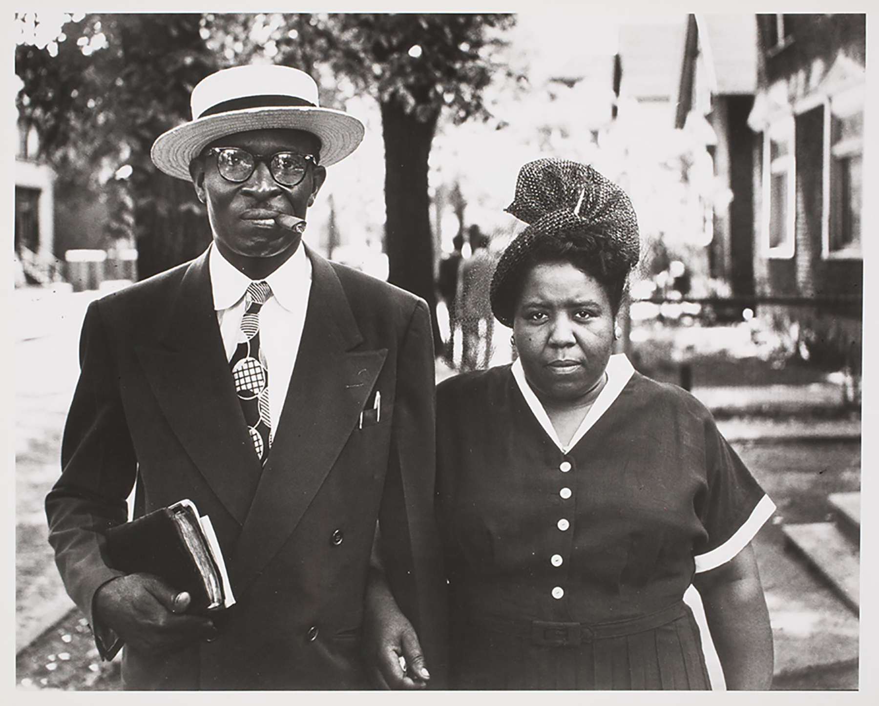 A man and woman are dressed for church.
