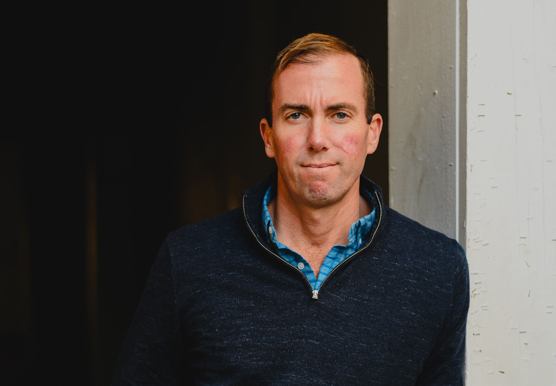 A man in a dark blue shirt