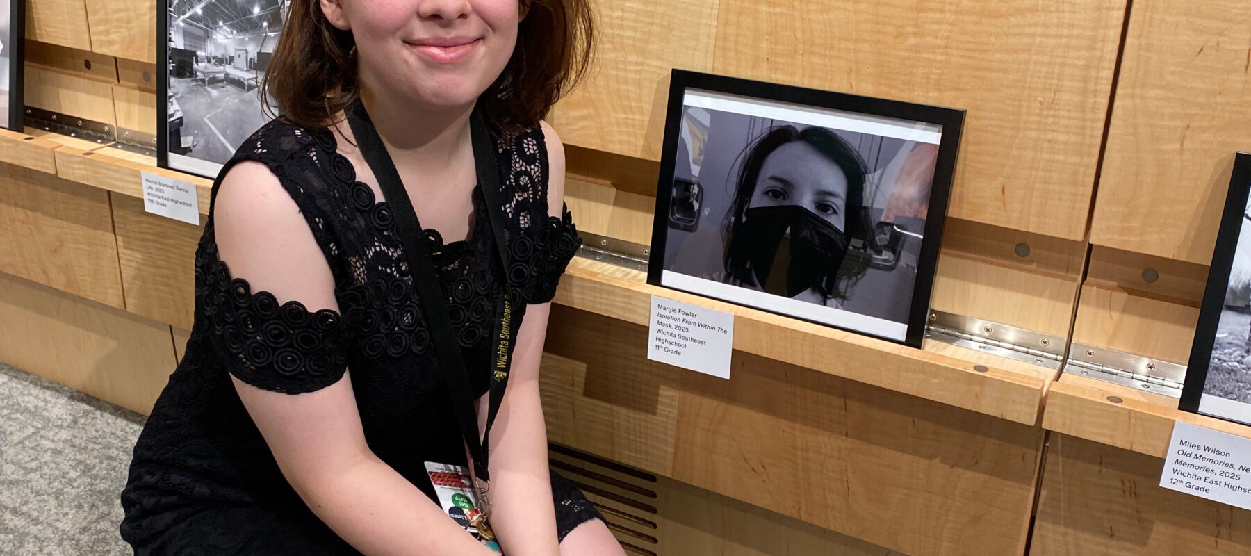 A student poses with her award-winning photograph.