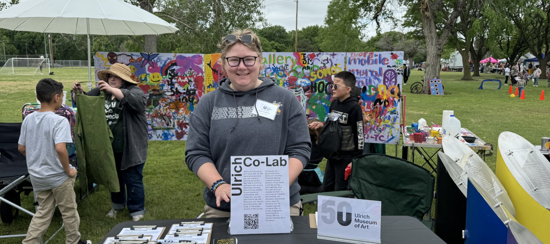 A student greets visitors at the Ulrich booth at Open Streets | NoMar