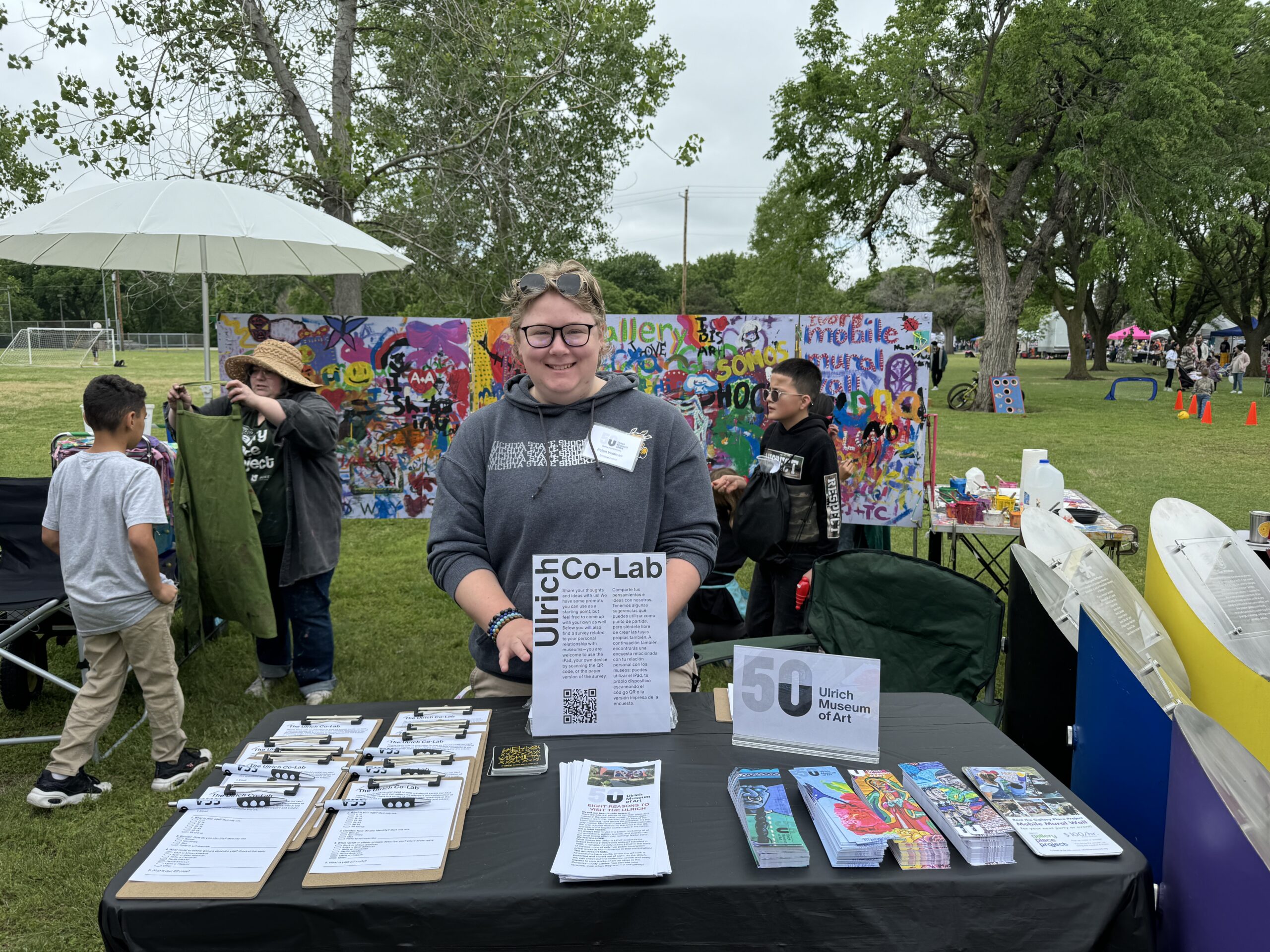 A student greets visitors at the Ulrich booth at Open Streets | NoMar