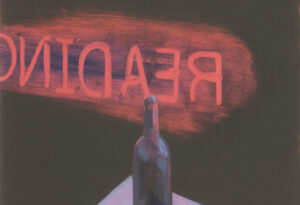 A sign painted on the inside of a window reads "Readings"