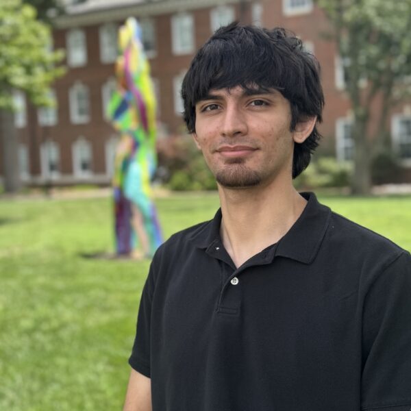 Antonio in front of sculpture